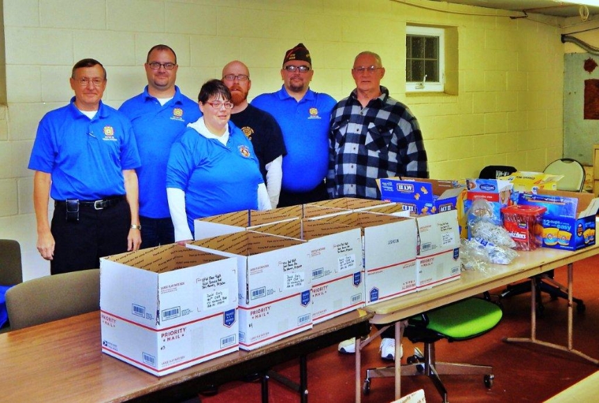 Members of Post 9668 assembled 18 boxes that will be sent to our comrades overseas.